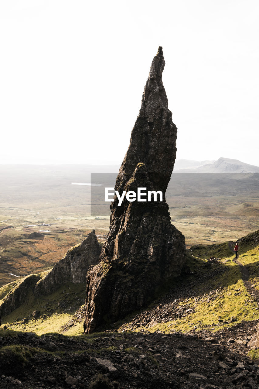 Rock formation on land against sky