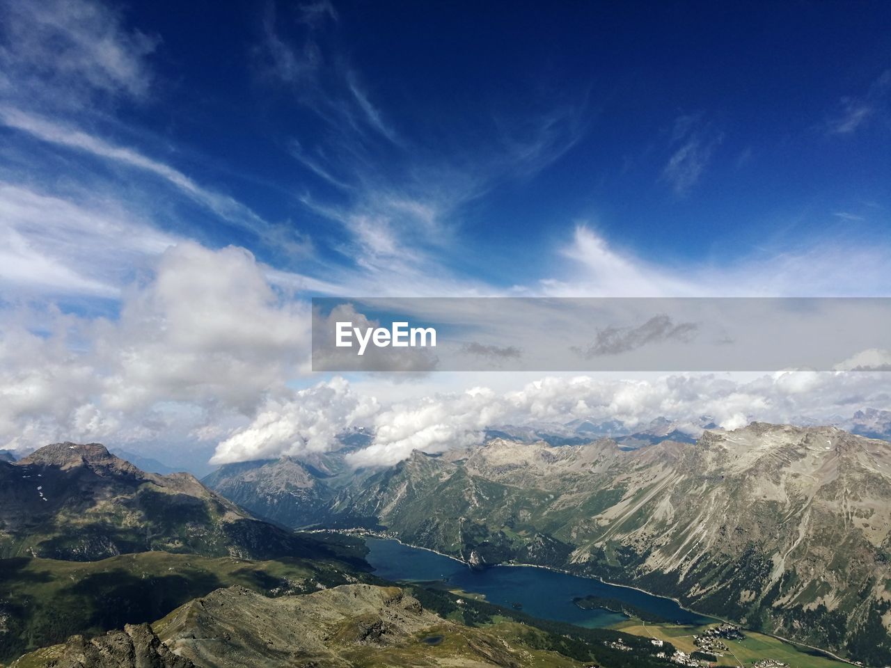 Scenic view of mountains against blue sky