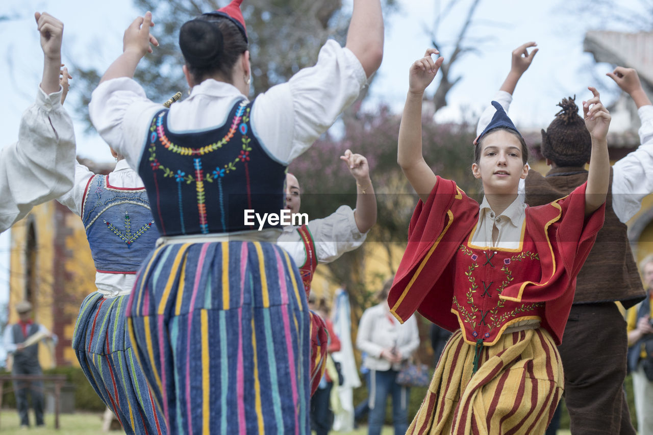 GROUP OF PEOPLE IN TRADITIONAL FESTIVAL