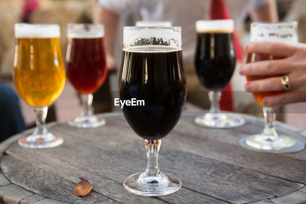 Beer glasses served on table