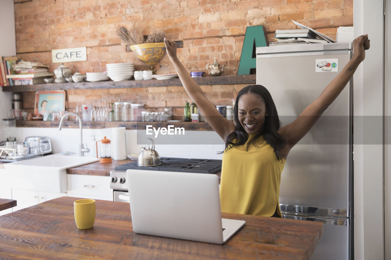 Businesswoman stretching while working at home