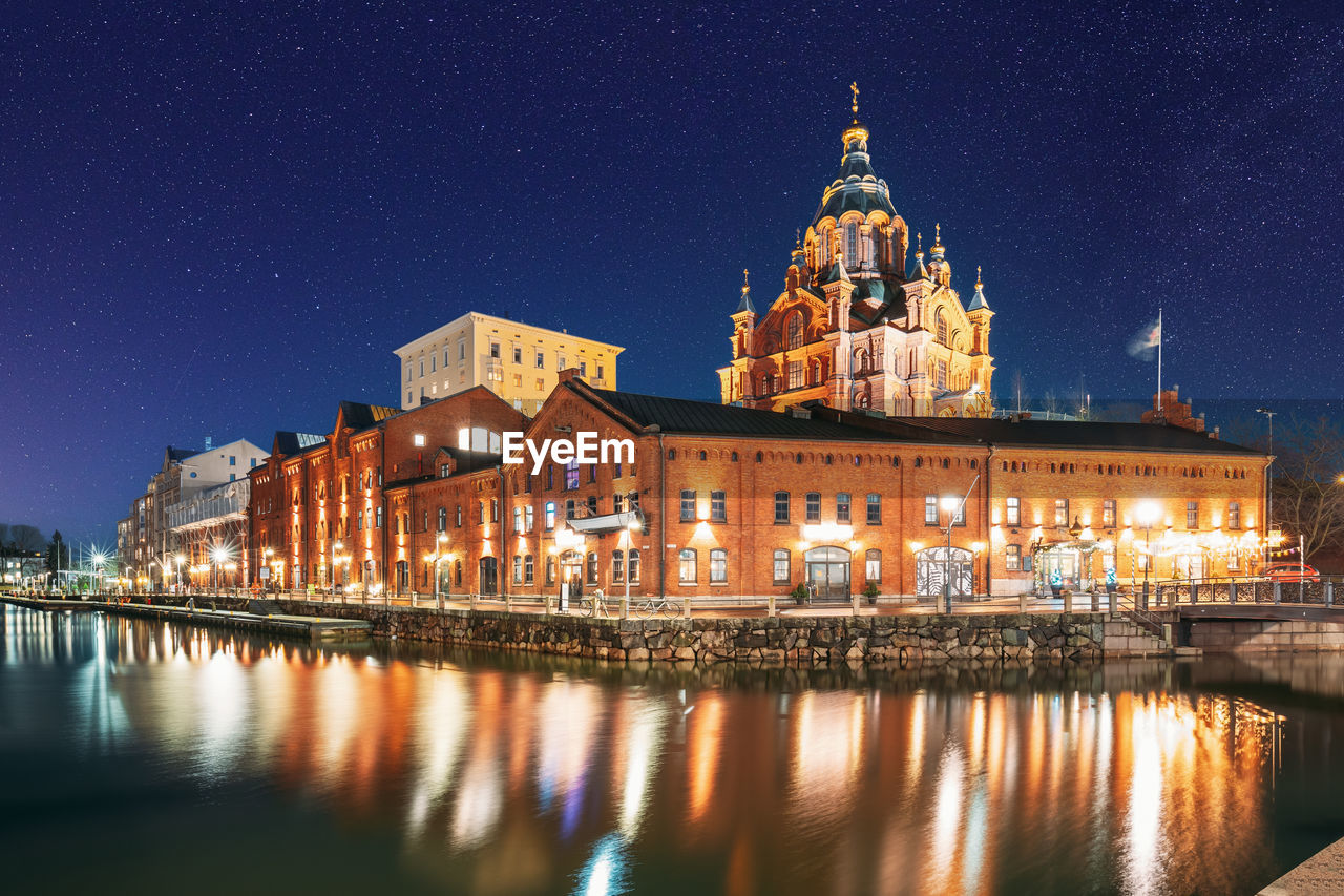 reflection of illuminated buildings in water