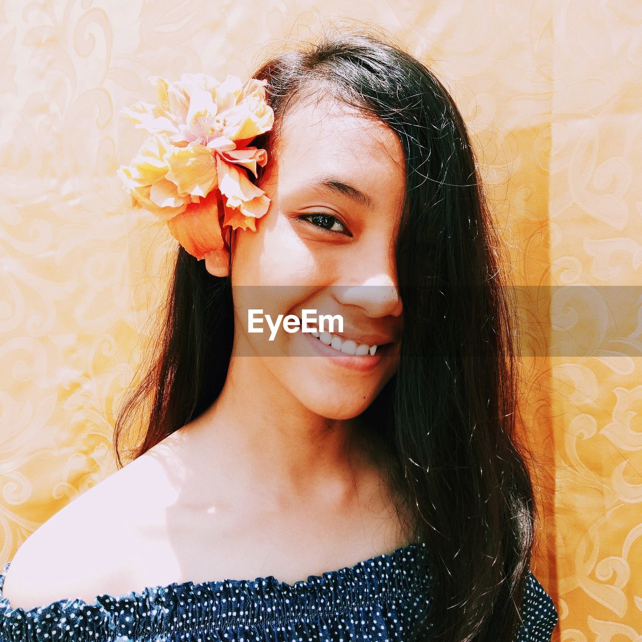 Close-up portrait of smiling teenage girl