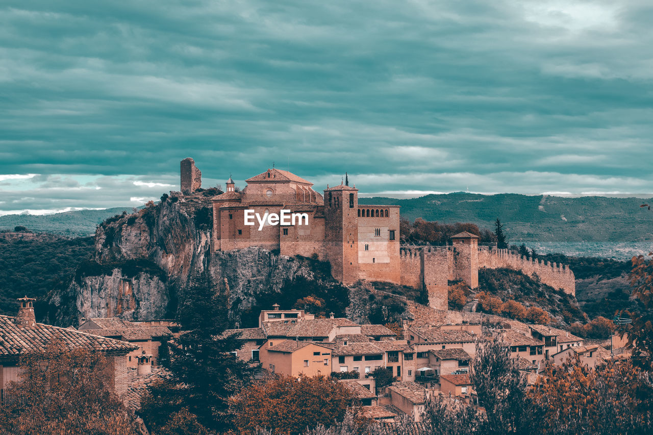 view of old ruins against cloudy sky