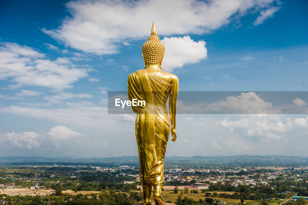 Statue of buddha against sky