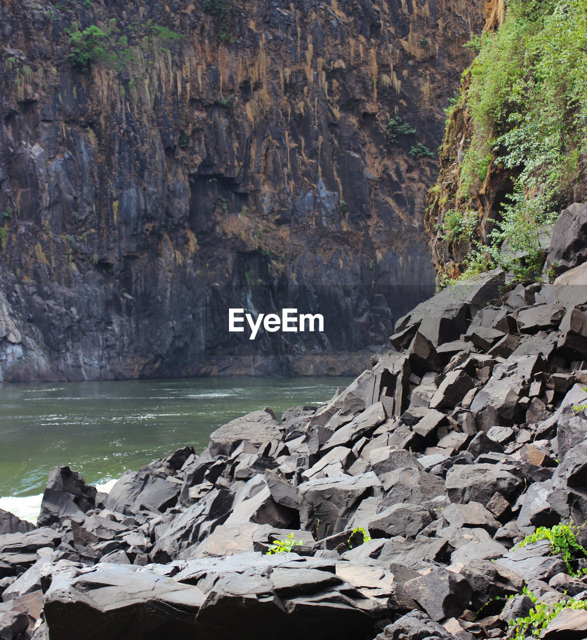 SCENIC VIEW OF SEA AND ROCK FORMATION