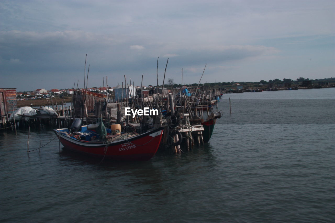 BOATS MOORED IN HARBOR