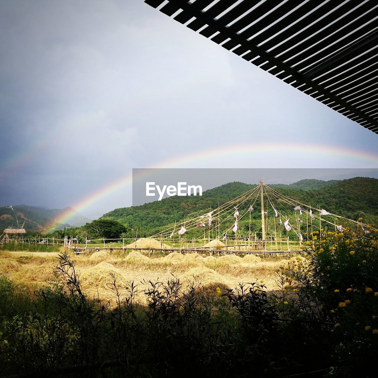 SCENIC VIEW OF RAINBOW OVER LANDSCAPE