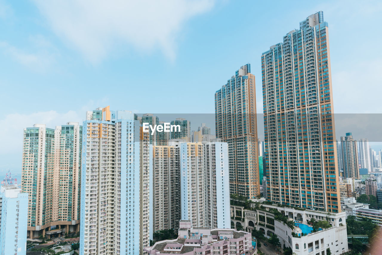 Modern buildings in city against sky