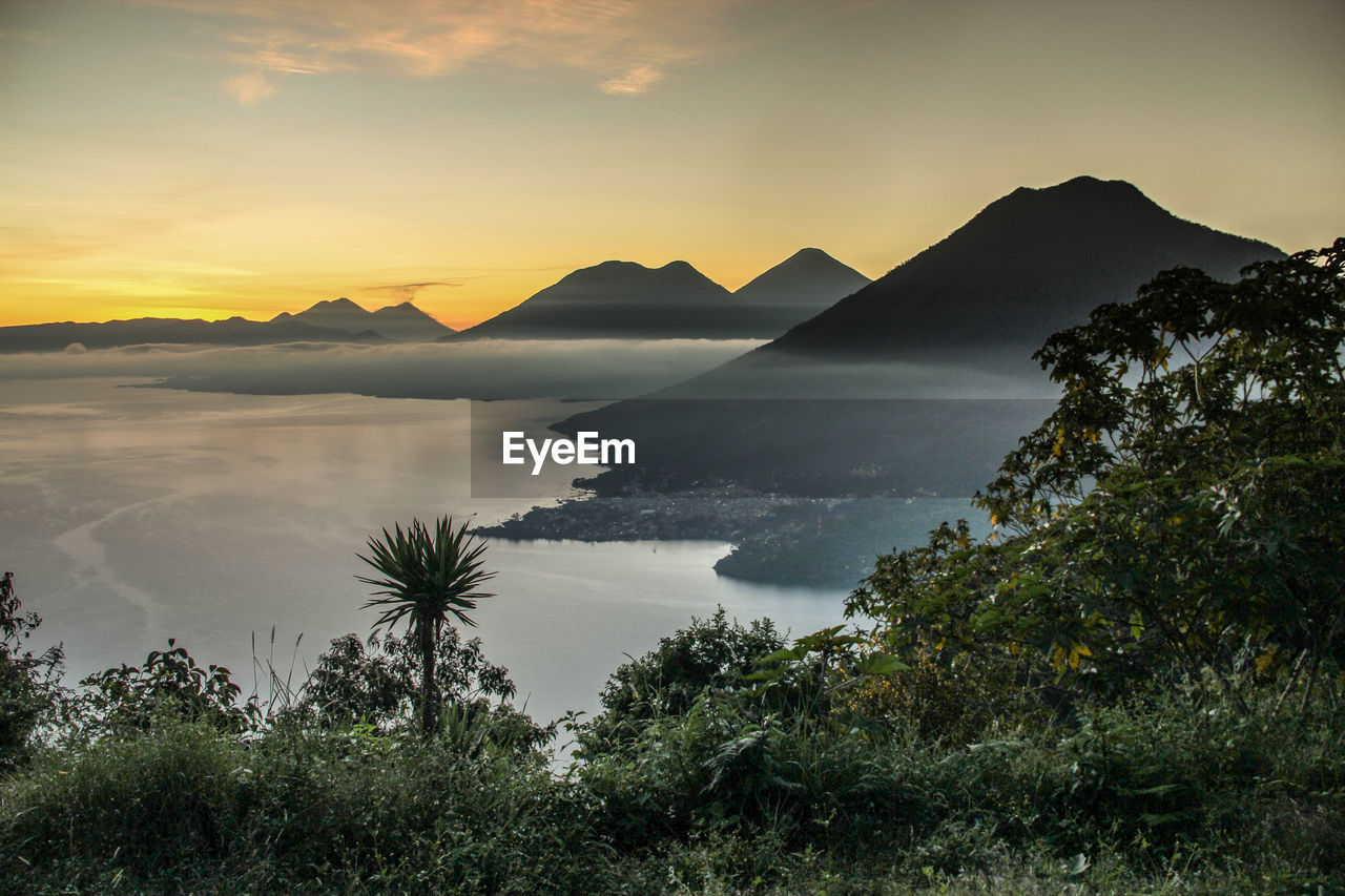 Scenic view of lake during sunset