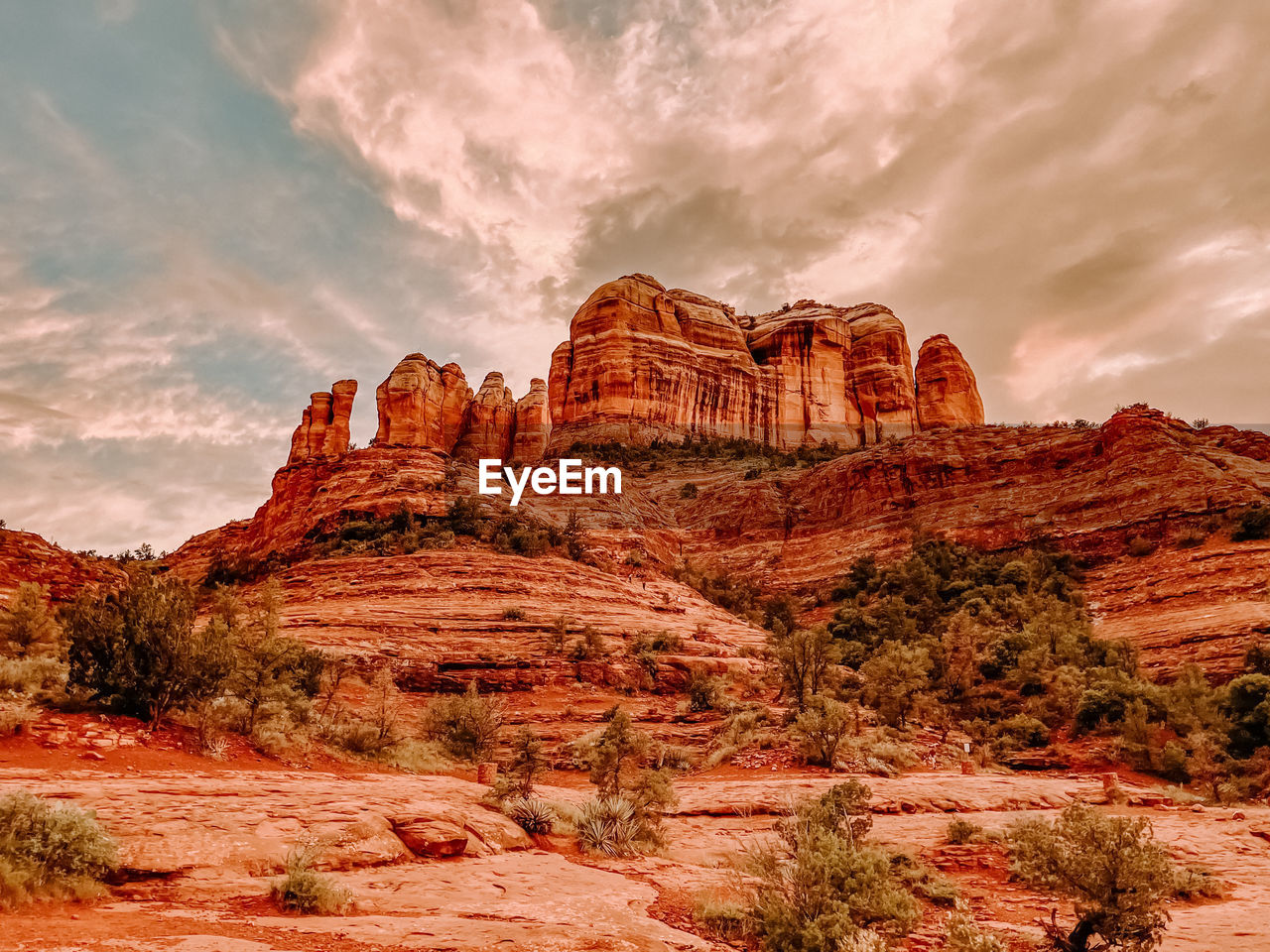 Red rock landscape against sunset