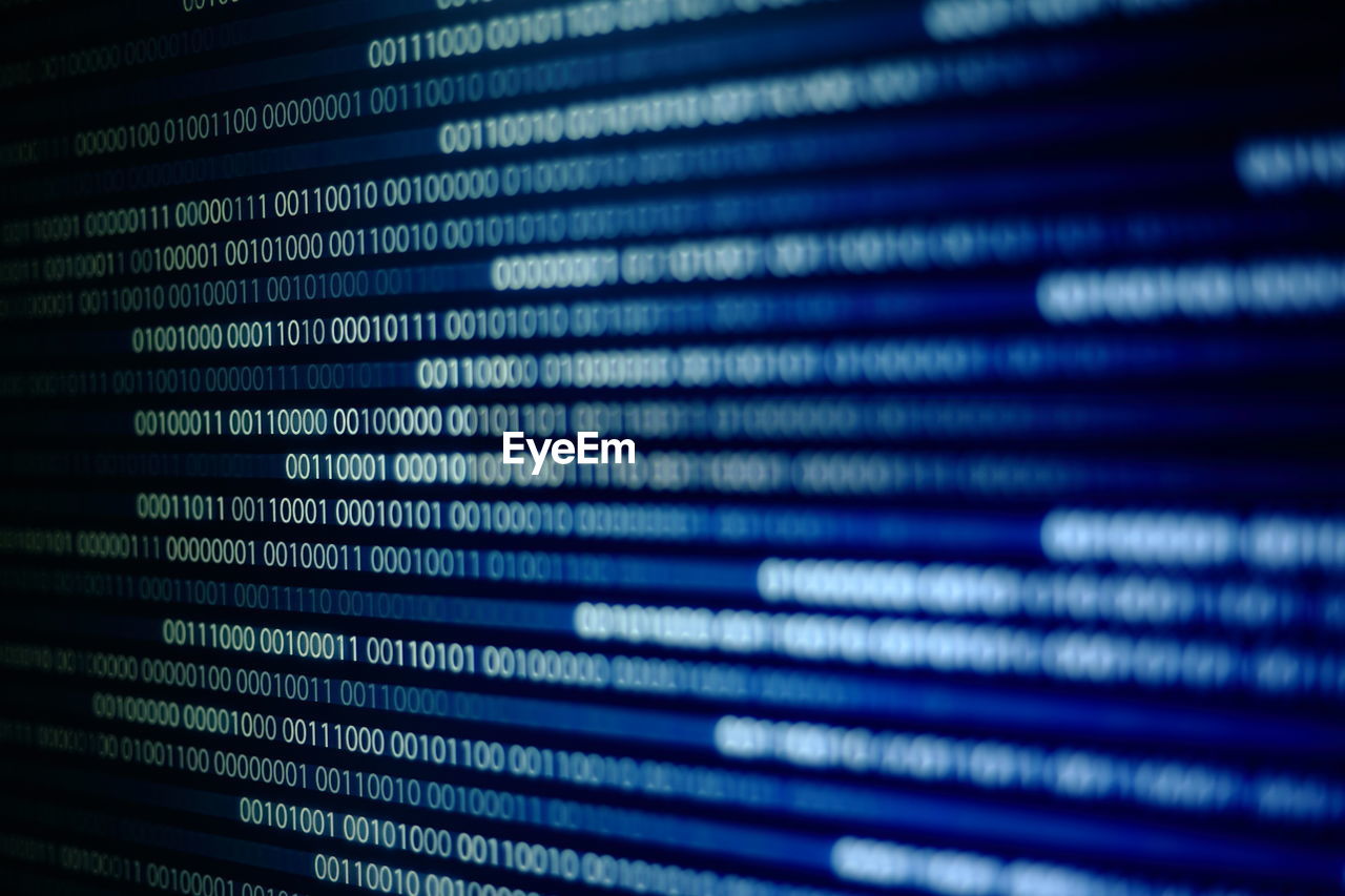 Close-up of binary code on black background