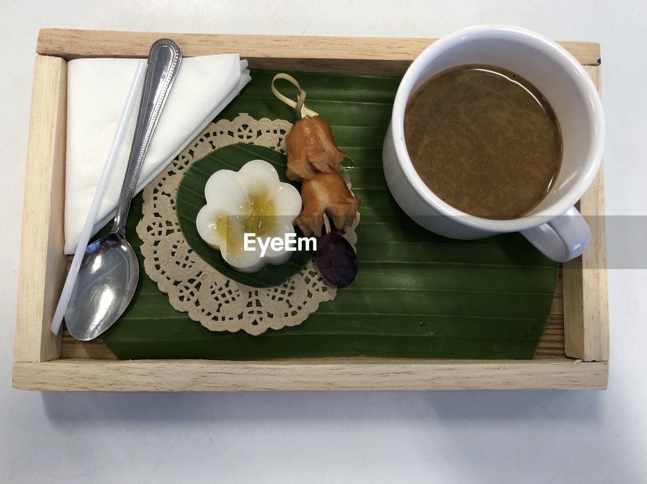 HIGH ANGLE VIEW OF ICE CREAM IN PLATE ON TABLE