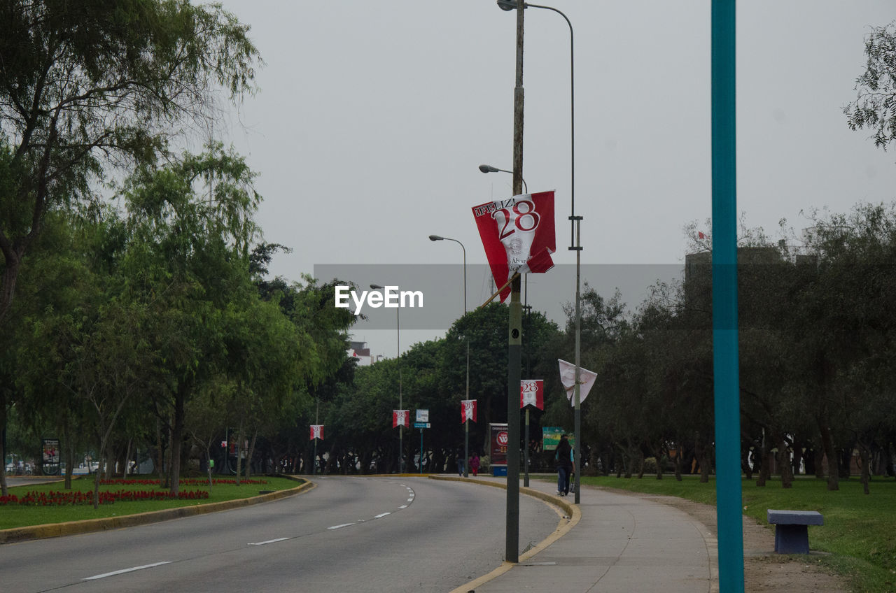 VIEW OF ROAD SIGN AGAINST SKY