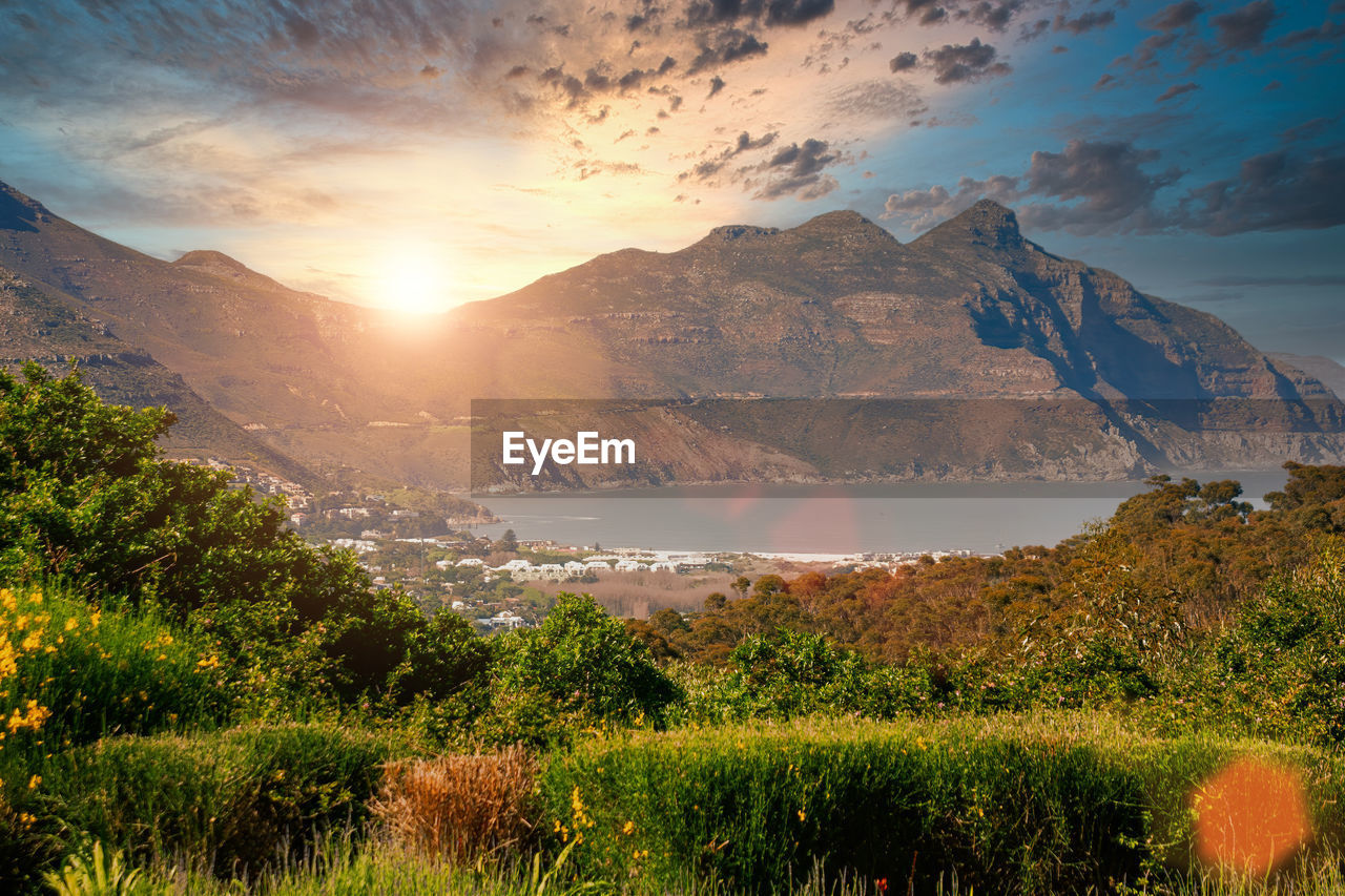 SCENIC VIEW OF LANDSCAPE AGAINST SKY AT SUNSET