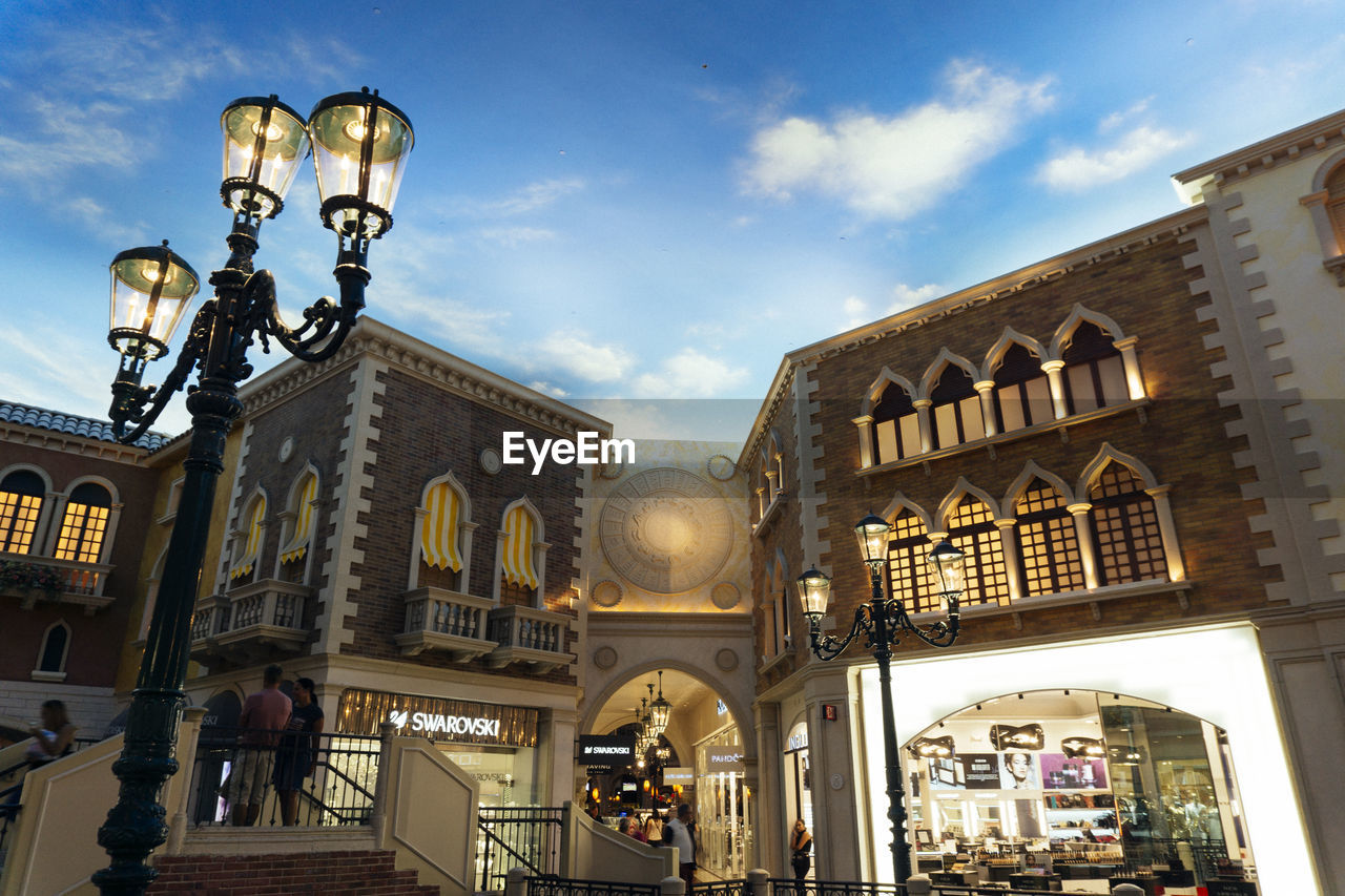 Low angle view of illuminated building against sky