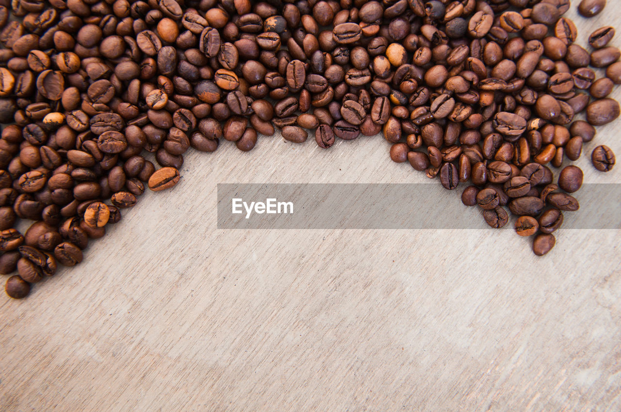 High angle view of roasted coffee beans on table