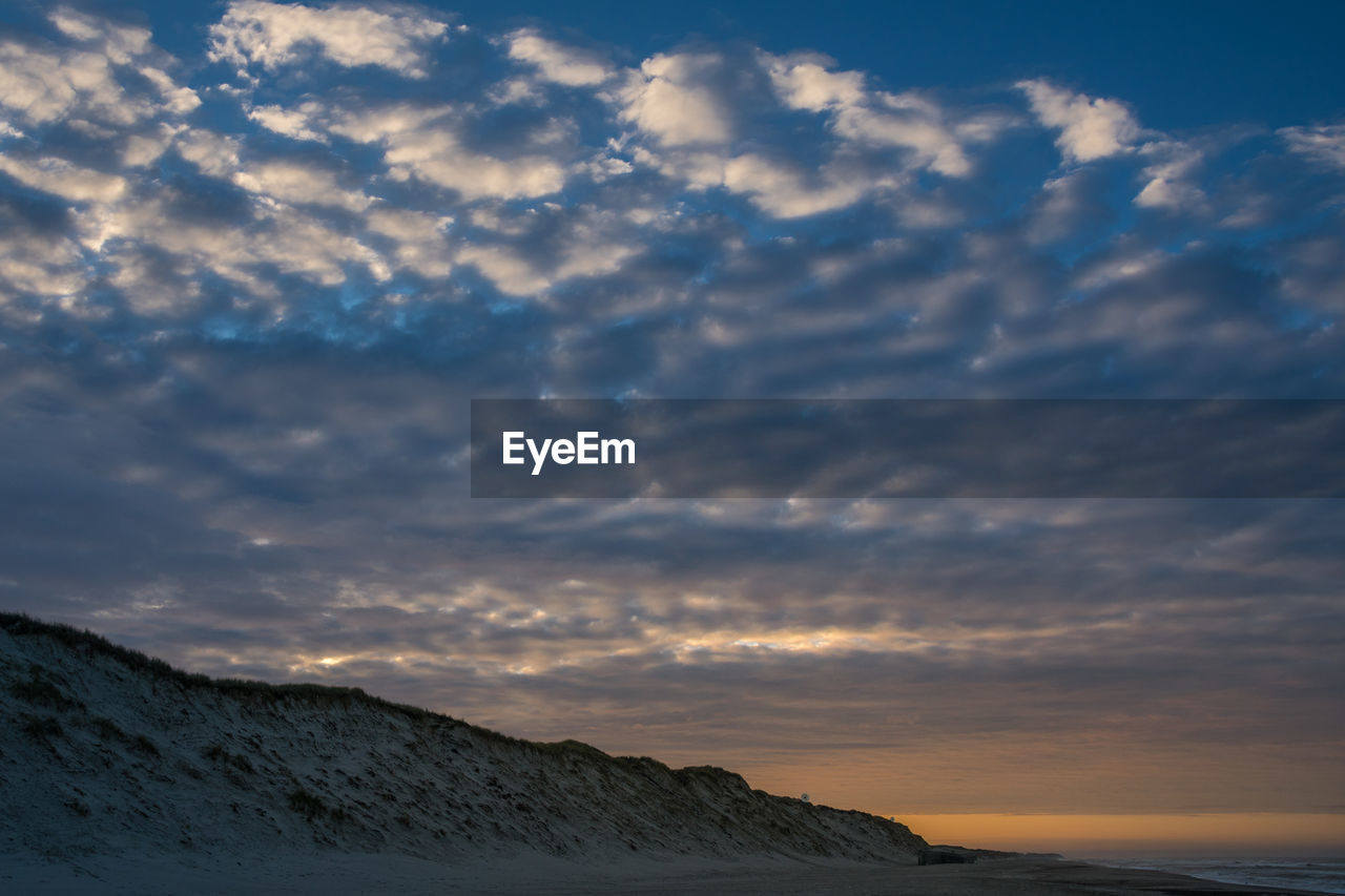 Scenic view of sea against sky at sunset