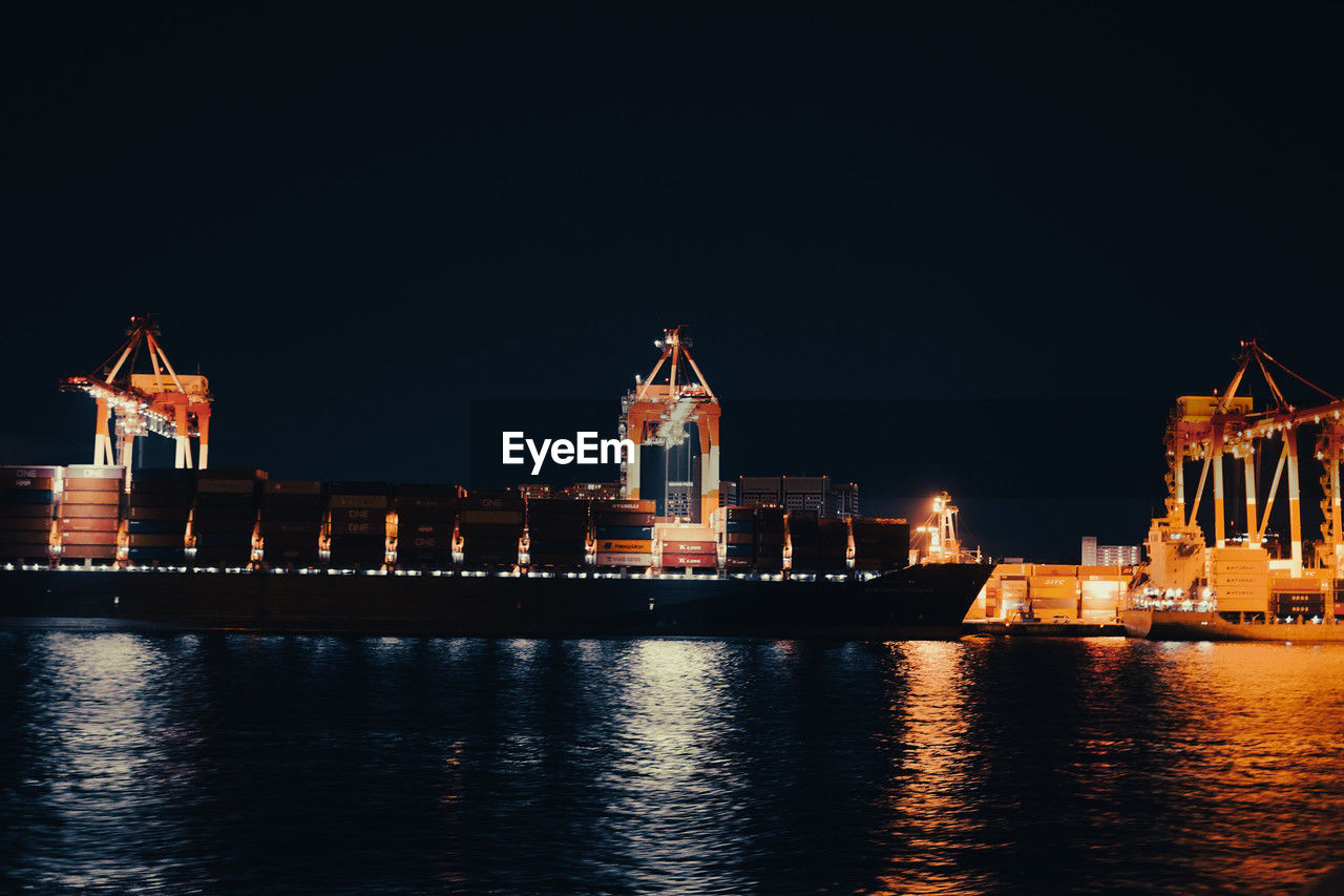 water, architecture, night, illuminated, built structure, reflection, building exterior, transportation, evening, dusk, sky, nautical vessel, no people, river, nature, travel destinations, landmark, building, city, waterfront, skyline, ship, mode of transportation, outdoors, travel, copy space