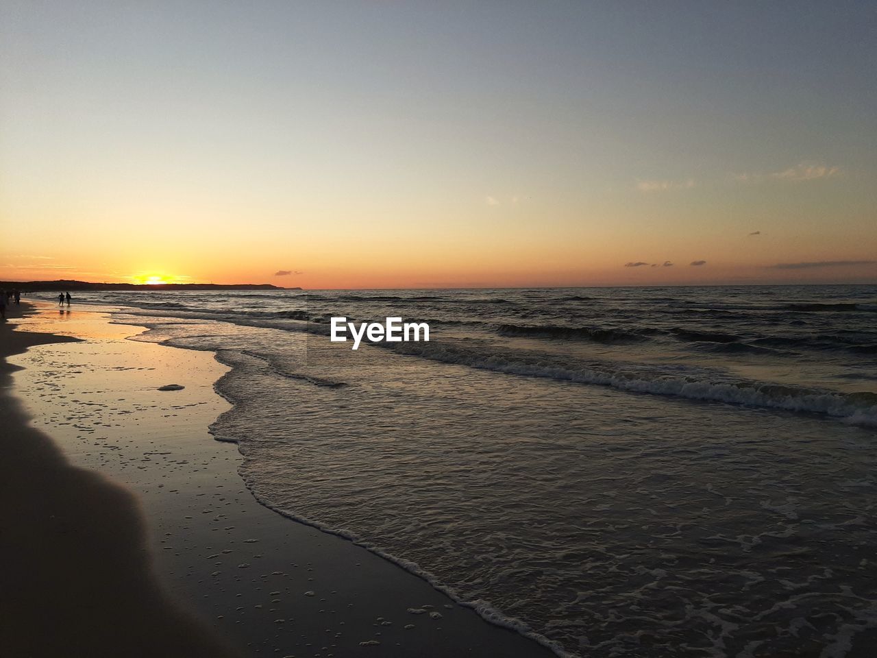 SCENIC VIEW OF BEACH DURING SUNSET AGAINST SKY