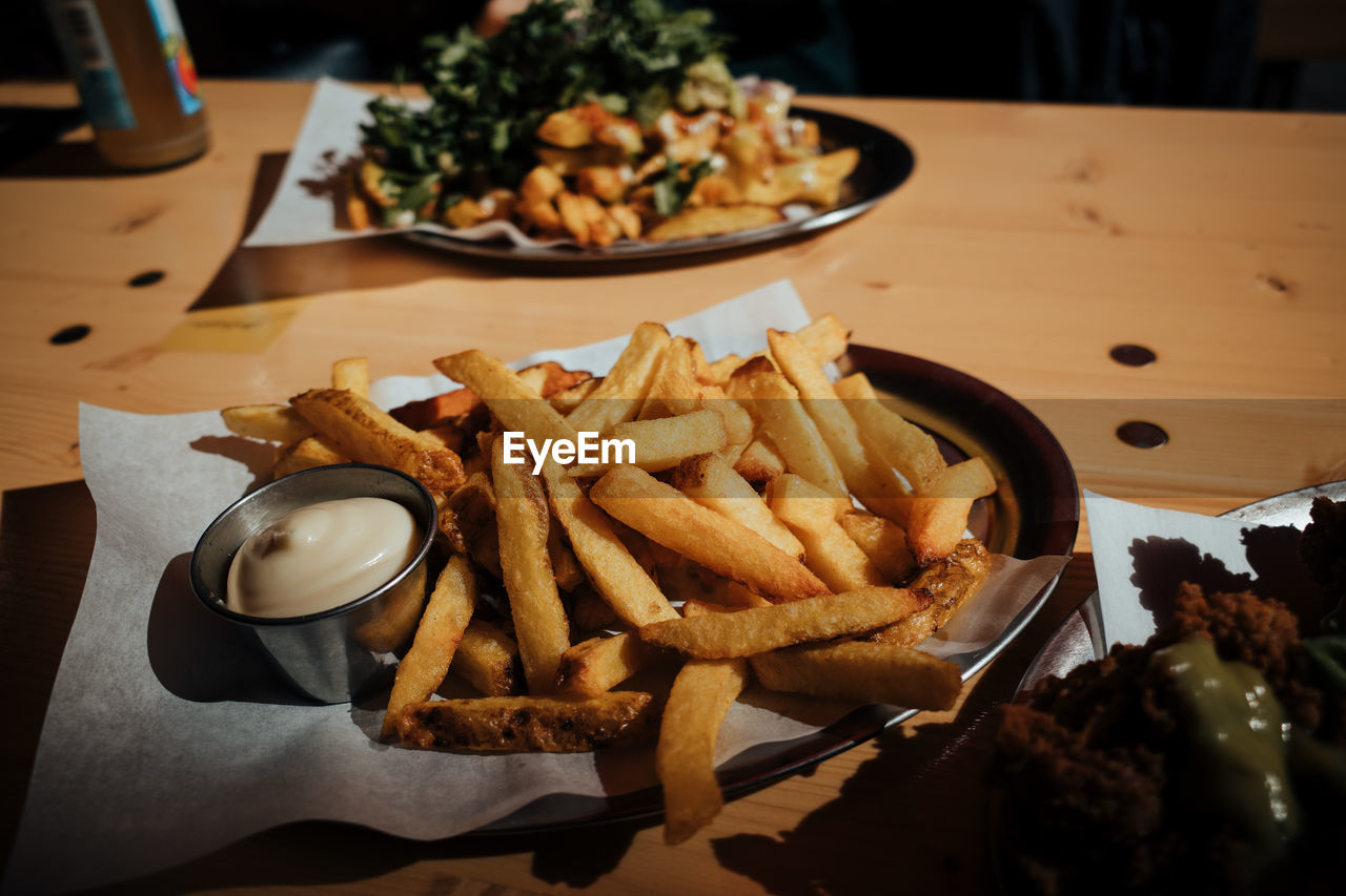 High angle view of french fries served on table