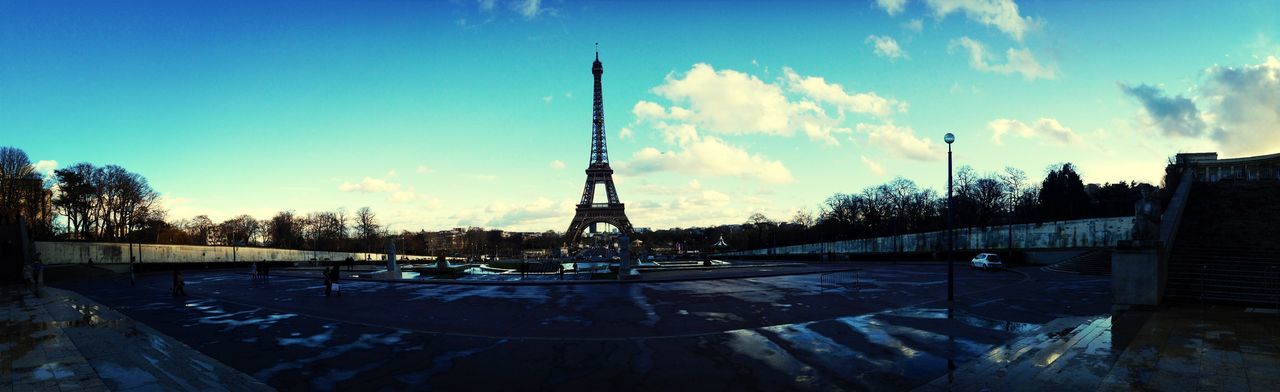 Eiffel tower against cloud sky