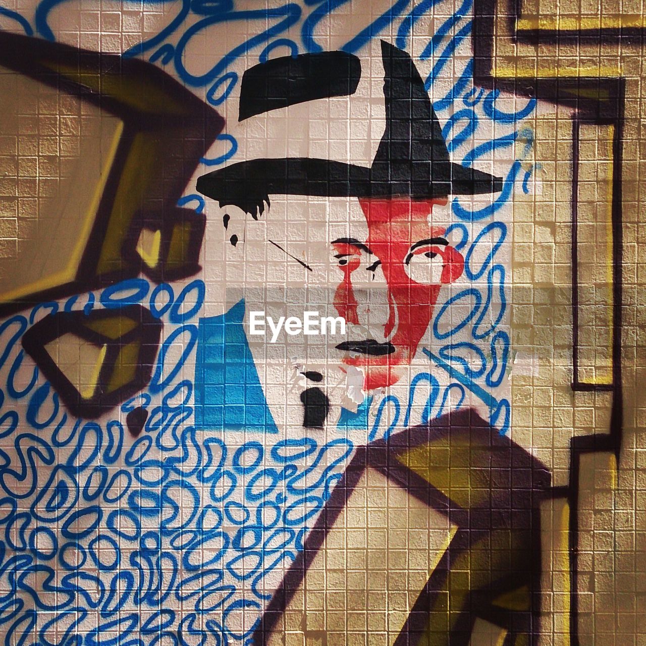 SHADOW OF GRAFFITI ON WALL