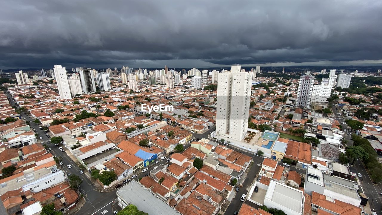 High angle view of buildings in city against sky