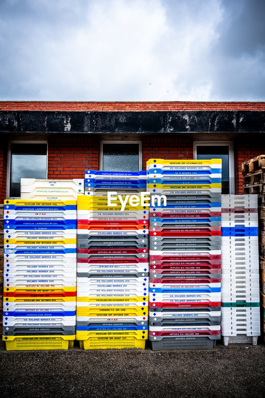 urban area, blue, multi colored, architecture, built structure, building exterior, sky, wall, no people, cloud, line, facade, day, yellow, art, outdoors, nature, interior design, building, city, window covering, red