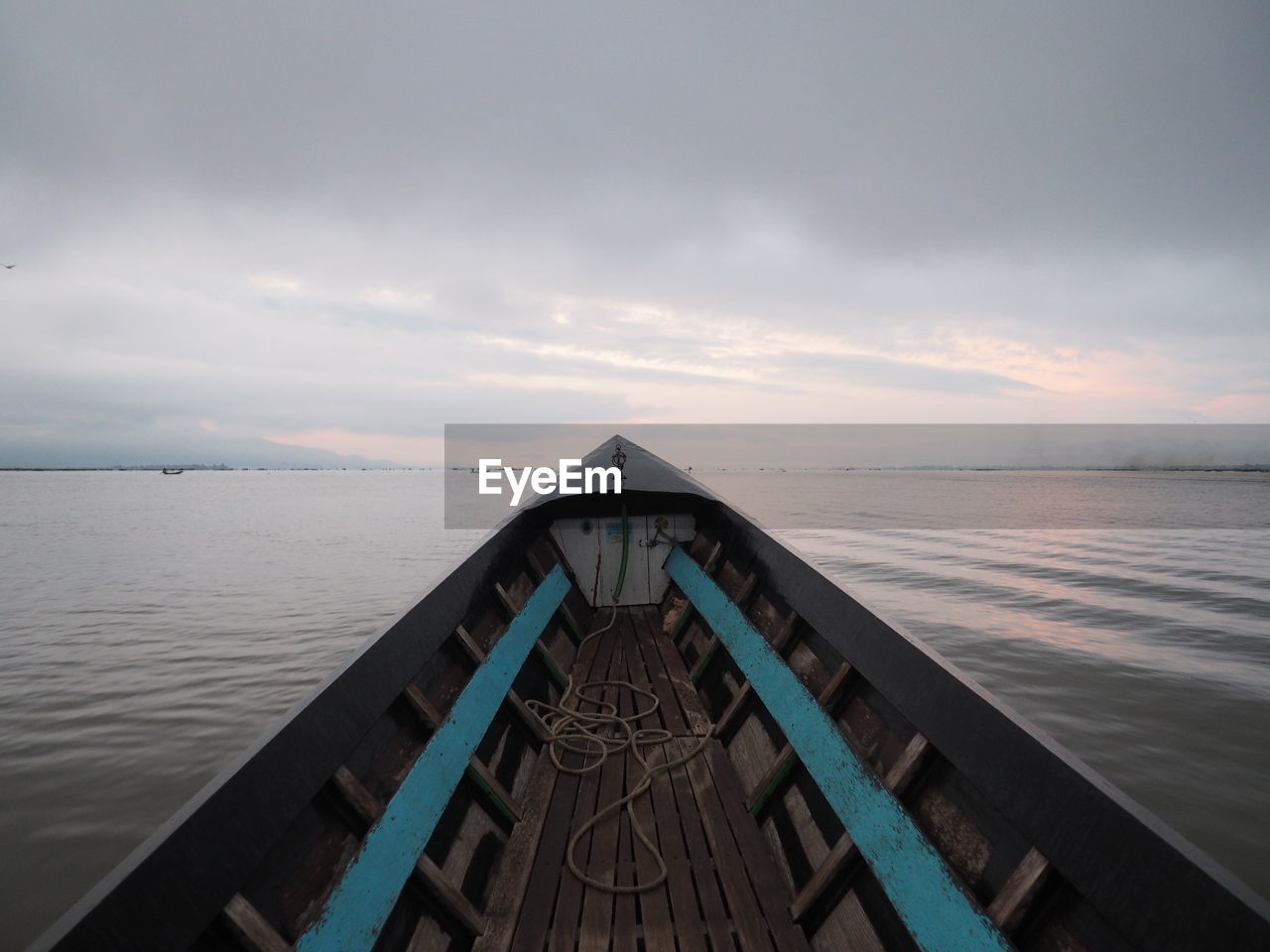 Empty boat on sea against sky