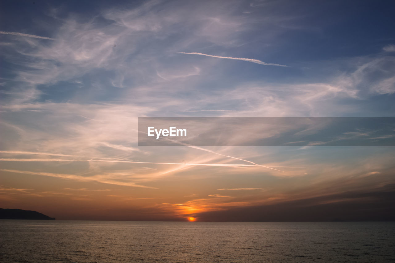 Scenic view of sea against sky at sunset