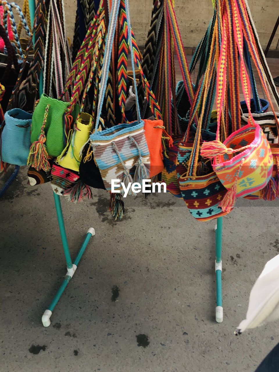 MULTI COLORED CHAIRS ON SWING