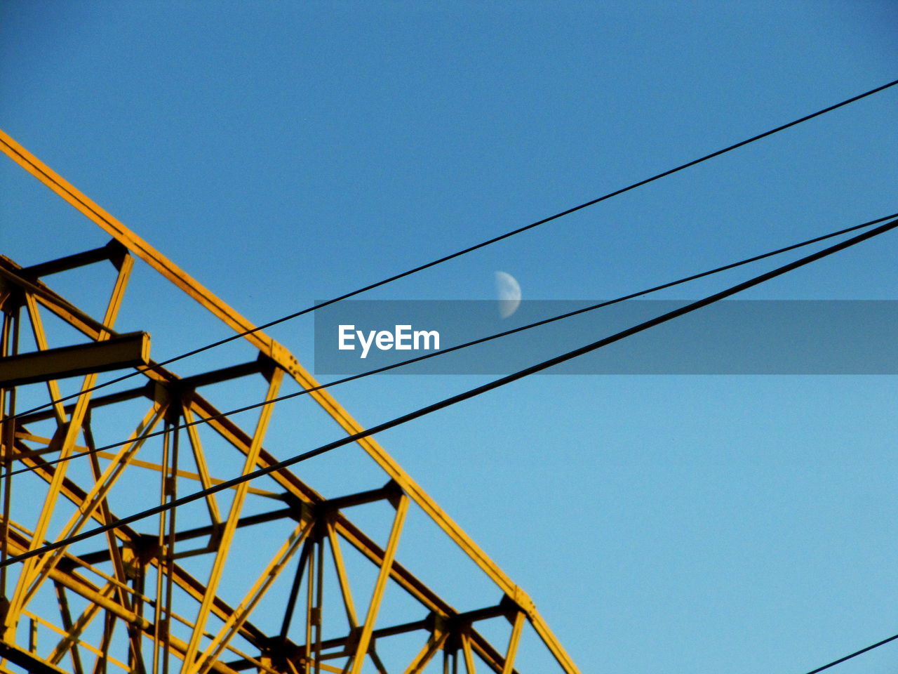 Low angle view of electricity pylon