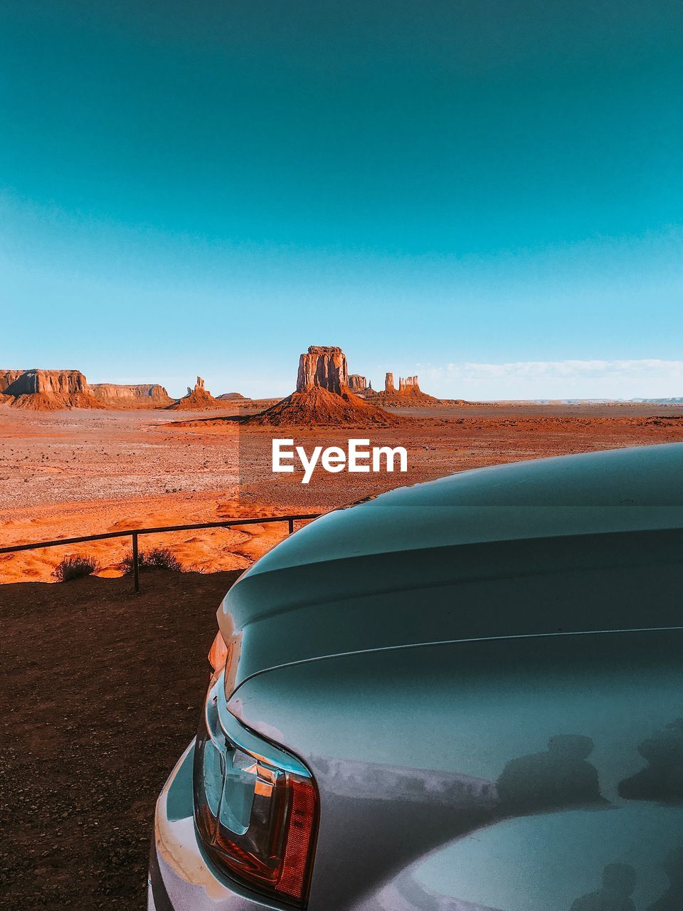 Car parked against monument valley