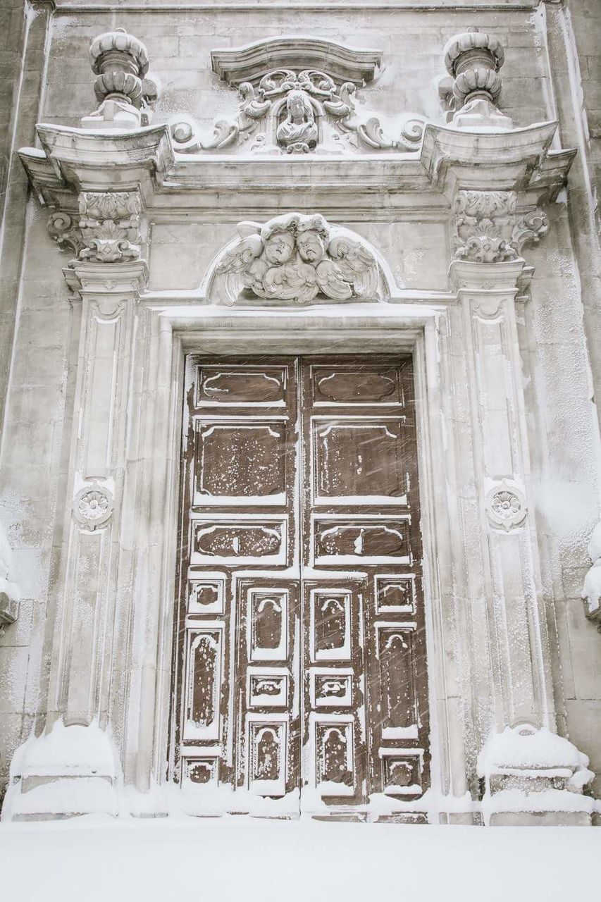 CLOSE-UP OF CLOSED DOOR WITH BUILDING