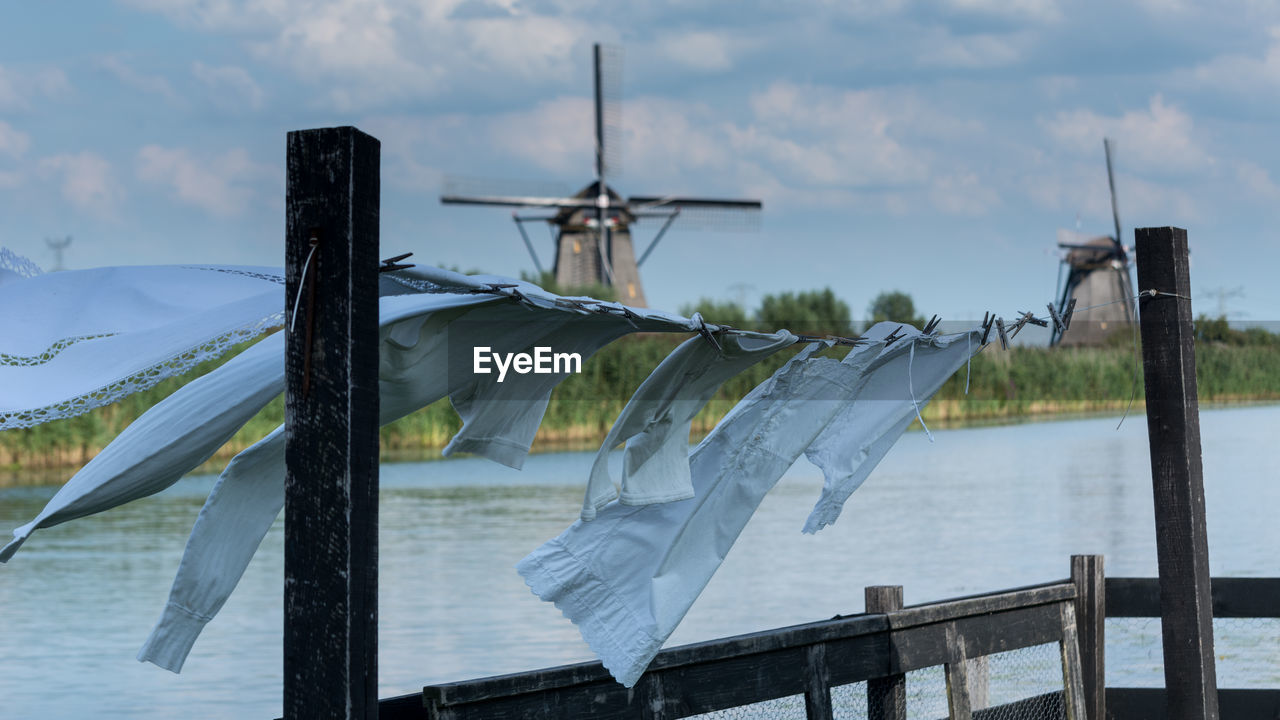 CLOSE-UP OF WINDMILL AGAINST SKY