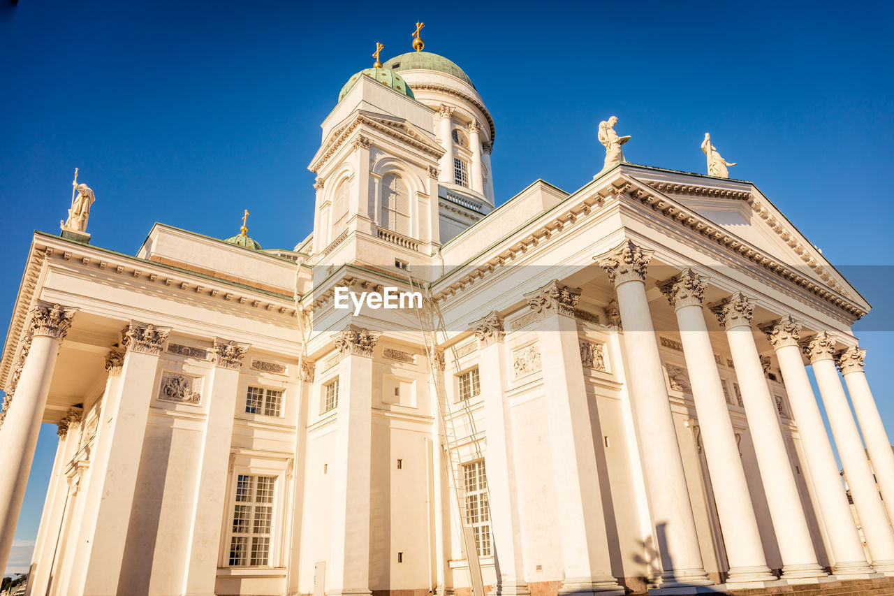 Low angle view of building against blue sky