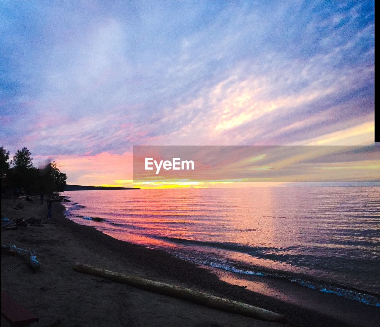 SCENIC VIEW OF SEA AGAINST ORANGE SKY