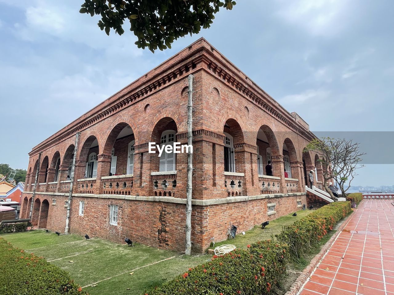 architecture, built structure, building exterior, sky, plant, estate, cloud, nature, building, history, the past, travel destinations, grass, landmark, tree, place of worship, no people, day, travel, outdoors, arch, brick, tourism, religion