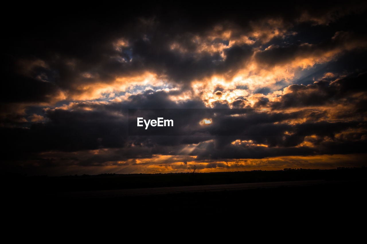 SILHOUETTE LANDSCAPE AGAINST SKY AT SUNSET