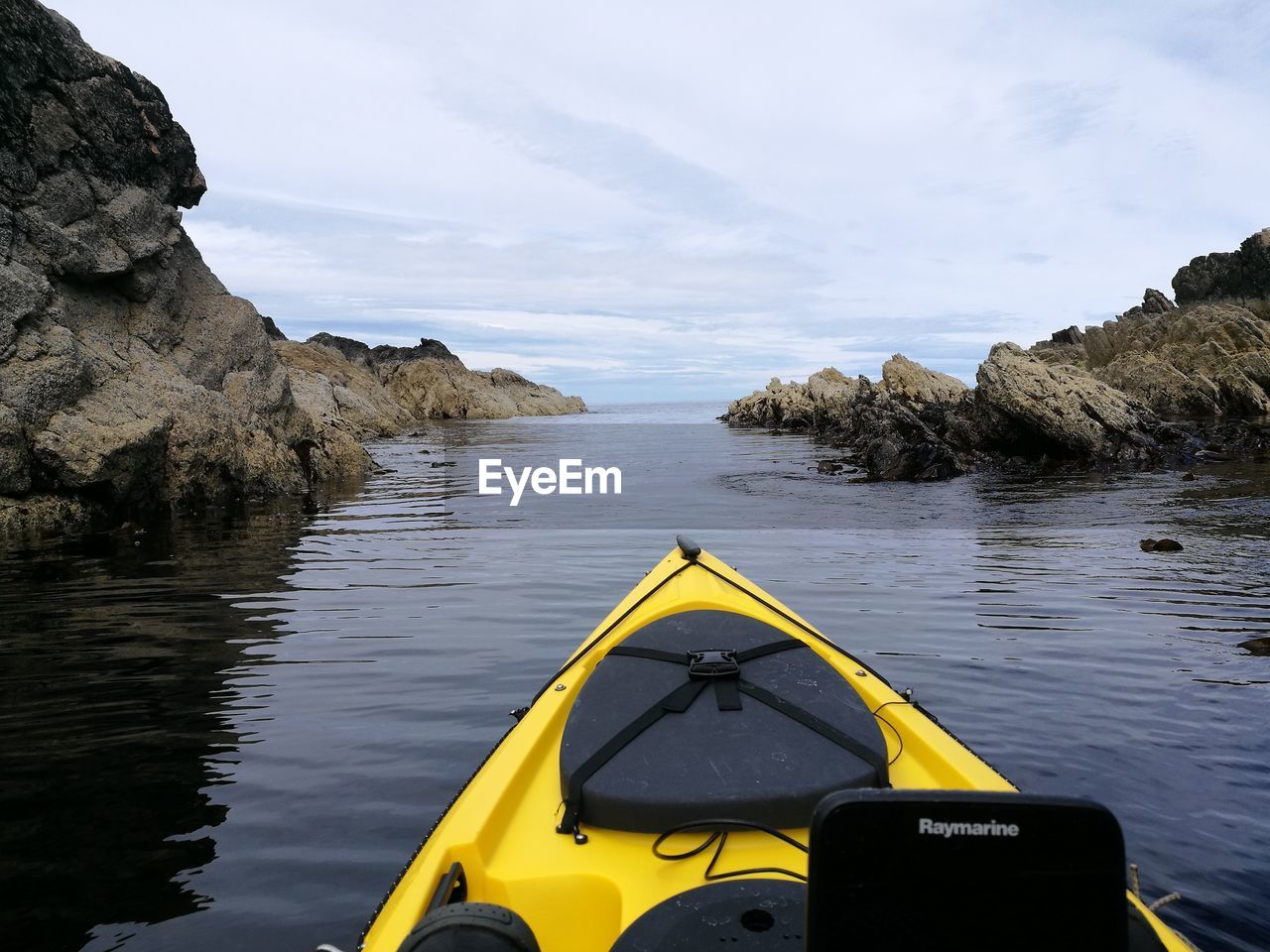 Close-up of yellow water in sea against sky