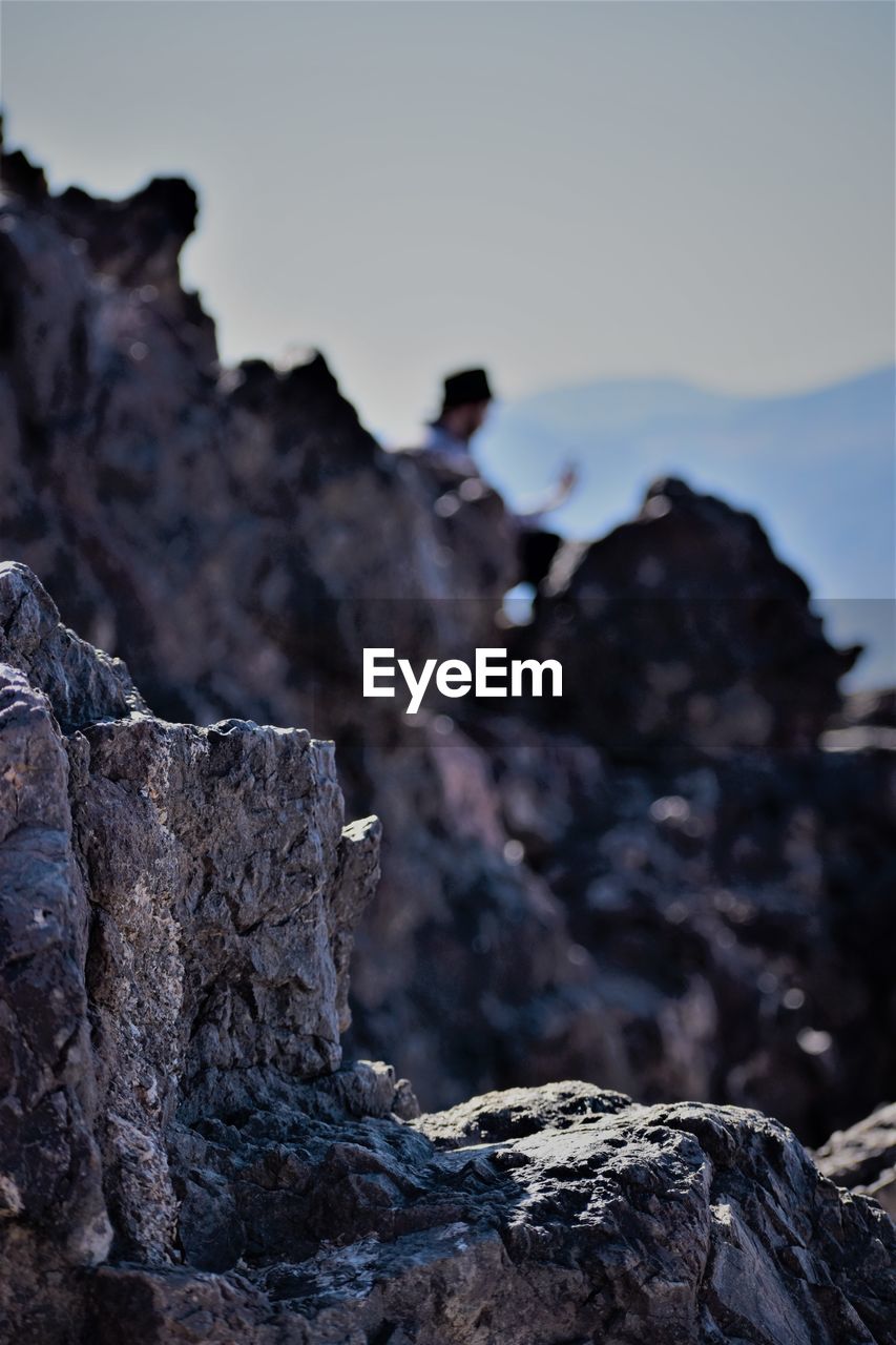 Low angle view of rock formation against sky