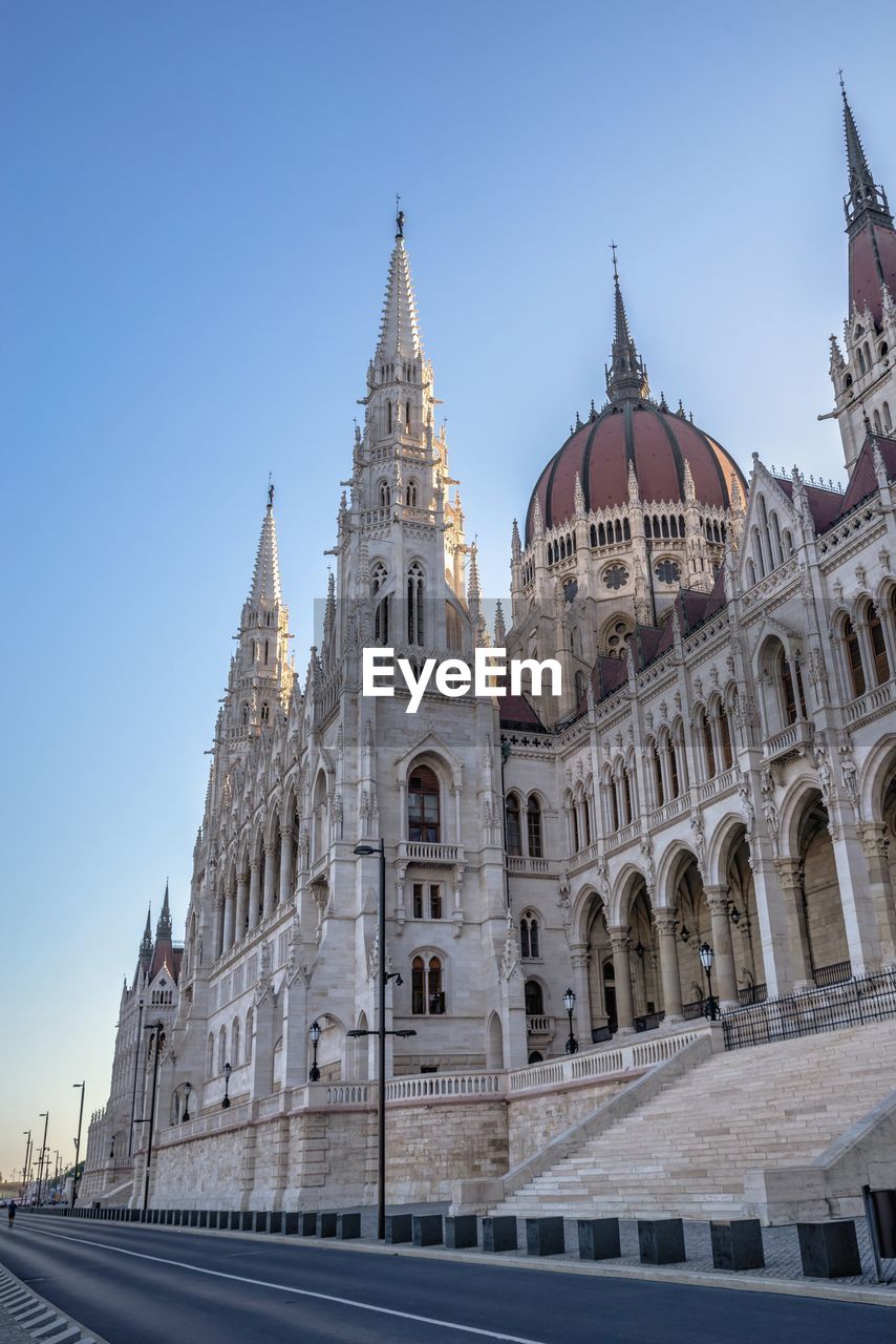  parliament building on the embankment of budapest, hungary, on a sunny summer morning