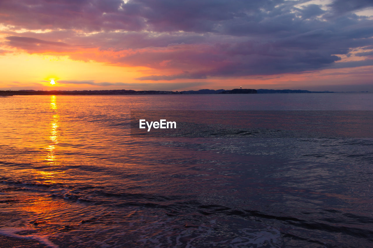 Scenic view of sea against sky during sunset