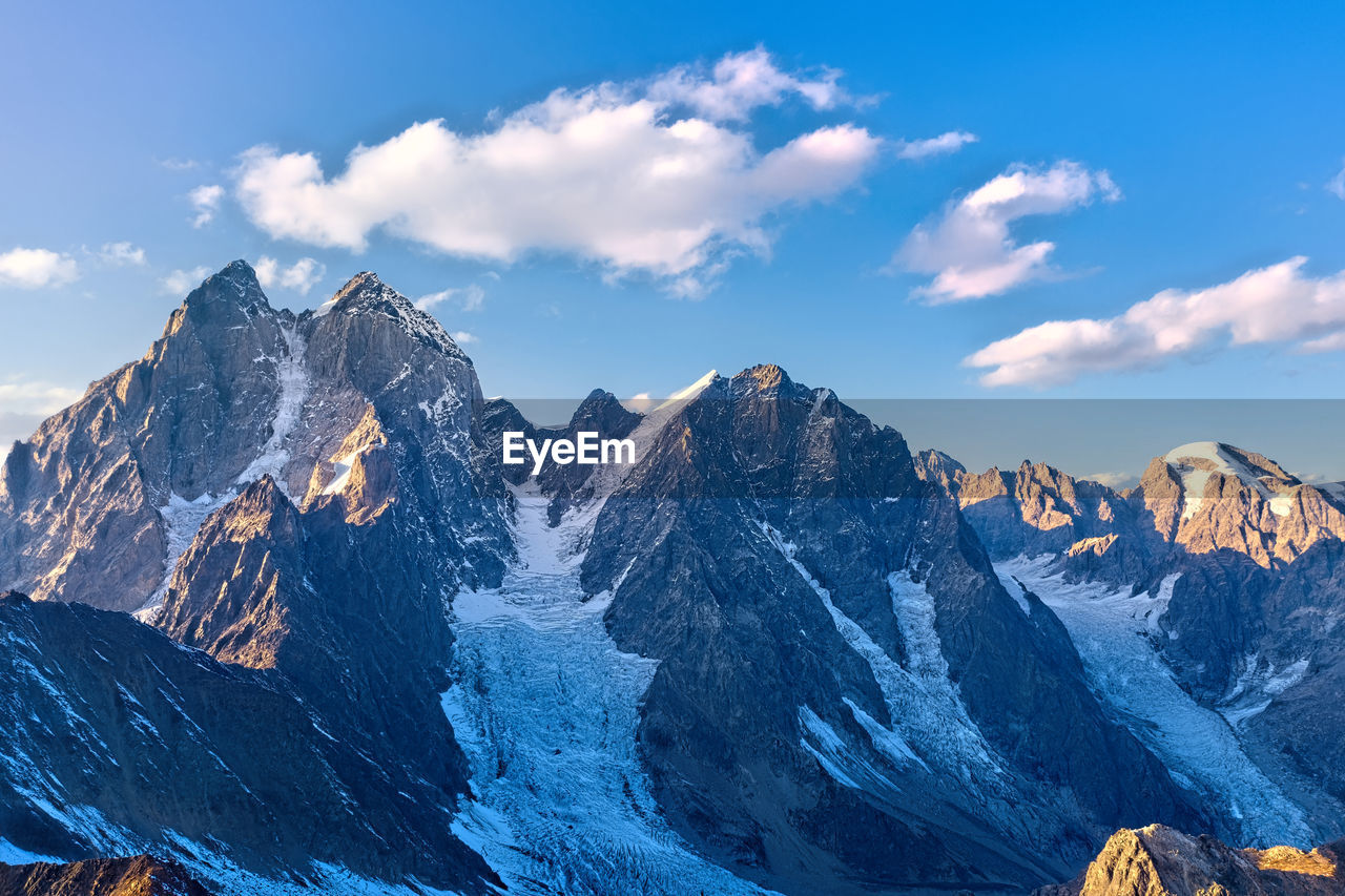 SCENIC VIEW OF SNOWCAPPED MOUNTAIN AGAINST SKY