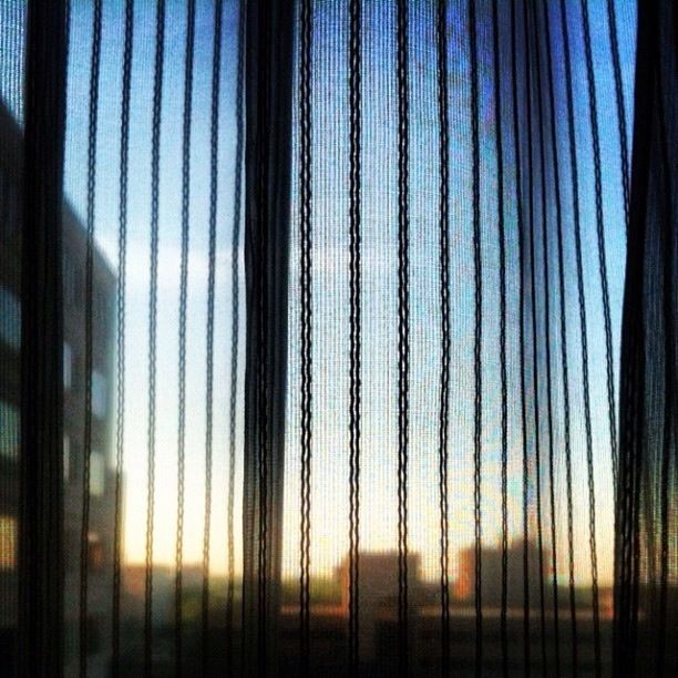 VIEW OF SUNSET THROUGH WINDOW