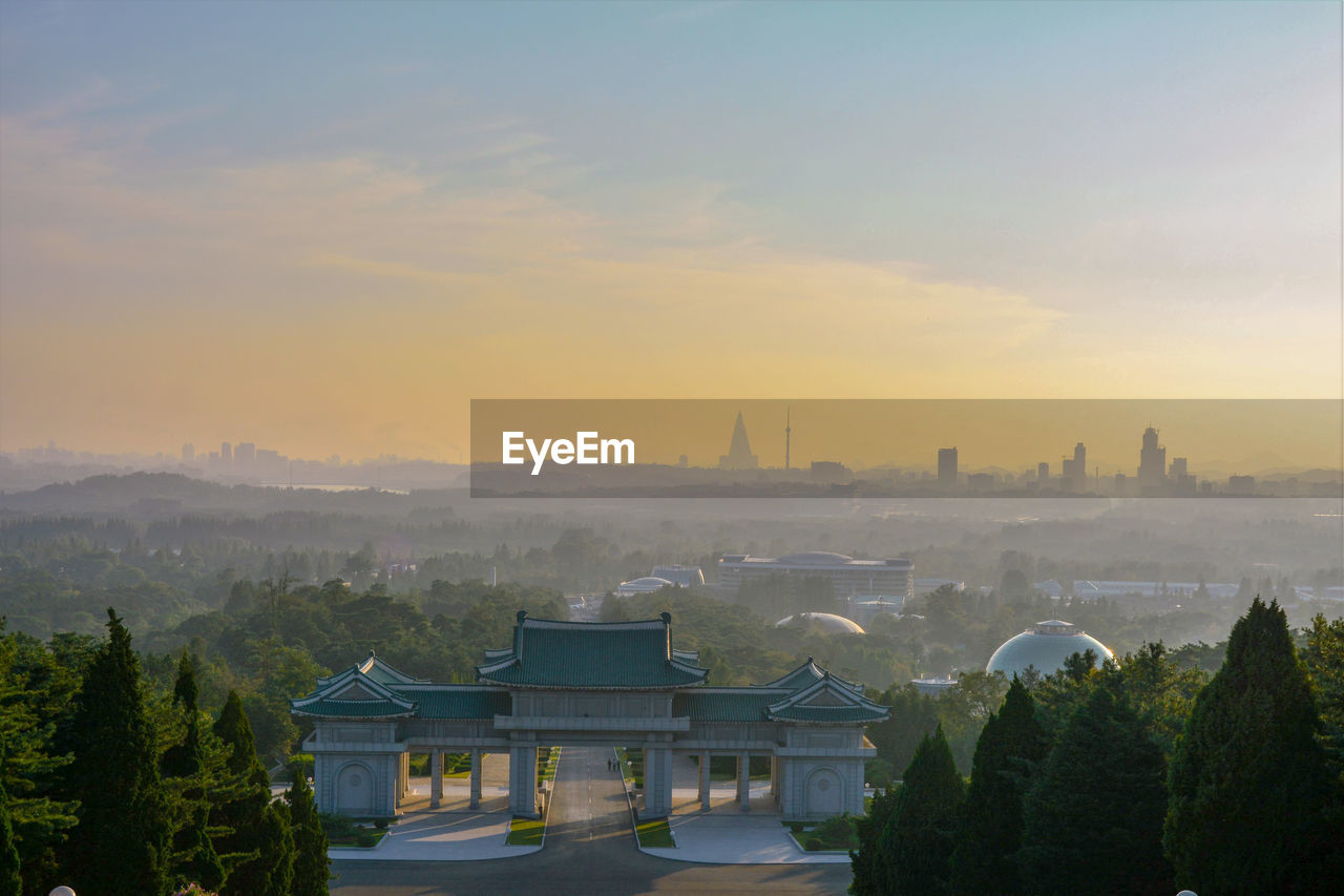 High angle view of buildings against sky during sunset