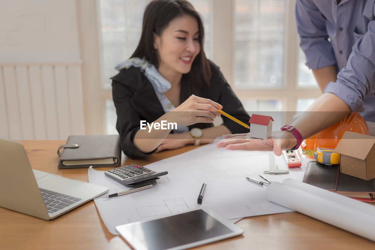 WOMAN WORKING AT TABLE