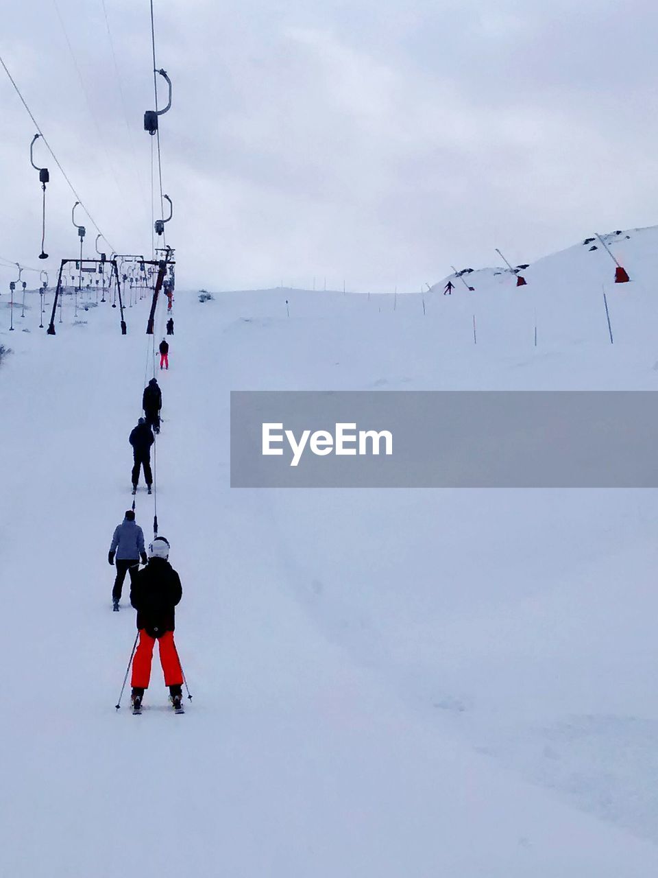 Man hiking on snow covered mountain