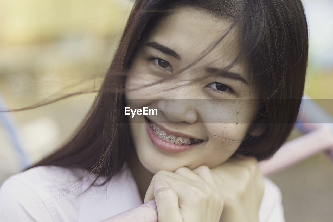 Close-up portrait of smiling woman